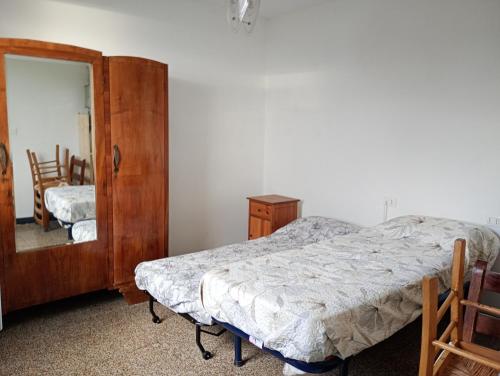 a bedroom with a bed and a dresser and a mirror at Golfo Paradiso in Camogli