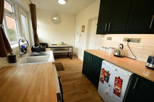 a kitchen with a sink and a counter top at Old Street Terrace in Ludlow