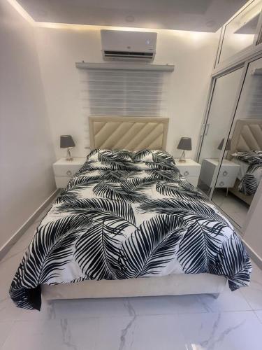 Un pat sau paturi într-o cameră la Apartamento