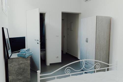 a view of a room with a staircase and a mirror at Cincin Casa in Francavilla Fontana