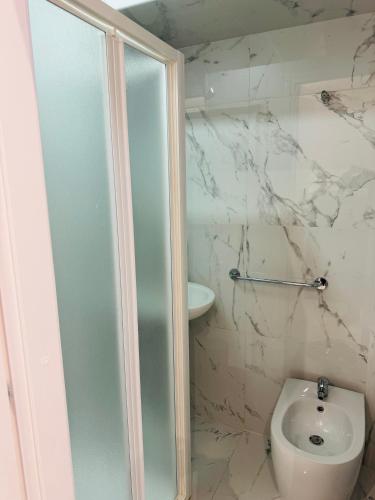 a bathroom with a shower and a toilet at Casa Roma in Rome