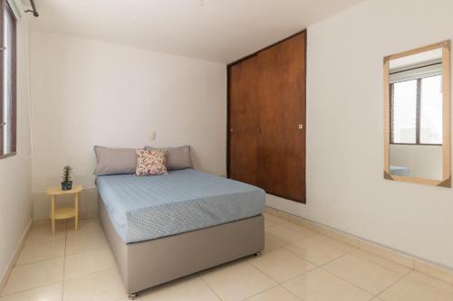 Postel nebo postele na pokoji v ubytování Casa de las Flores en Medellín
