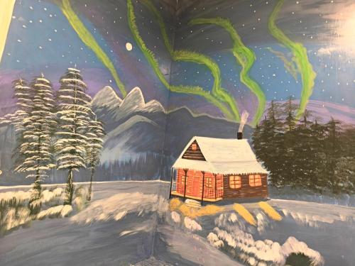 a painting of a house in the snow at Xinyuanbao Shangshi Homestay in Donggang