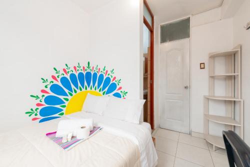 Una cama o camas en una habitación de Retablo Boutique Hotel