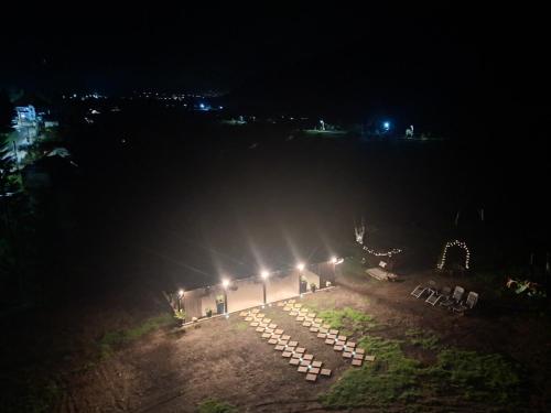 a row of lights in a field at night at Pensiunea Valurile Bistritei in Vatra Dornei