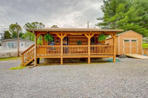 a large wooden gazebo with plants on it at Rivers View - Cherokee Lake Cabin with Fire Pit! in Bean Station