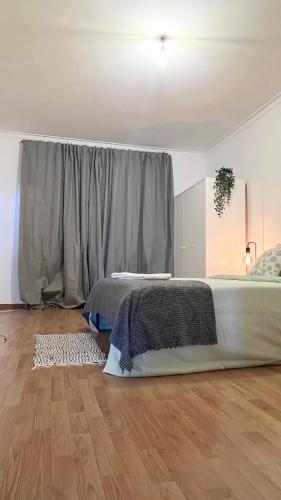Ένα ή περισσότερα κρεβάτια σε δωμάτιο στο Quarto duplo superior