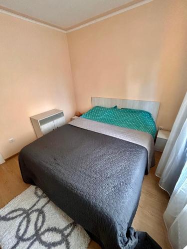 a bedroom with two beds in a room at Top Apartment in Gheorgheni