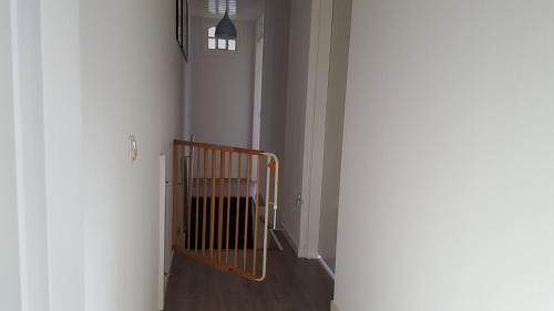 a hallway with a gate in a room at Boerderij de Borgh in Westerbork