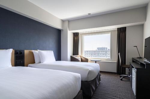 Postel nebo postele na pokoji v ubytování ANA Crowne Plaza Sapporo by IHG