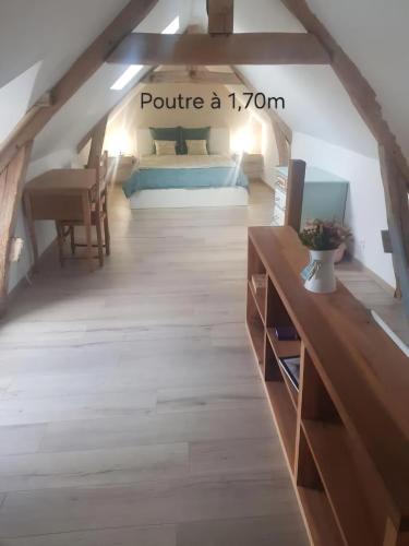 Postel nebo postele na pokoji v ubytování Gîte du temps perdu
