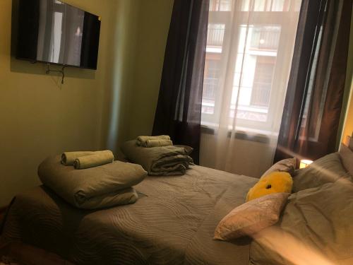 a bedroom with a bed with a stuffed animal on it at Oasis Valley in Karlovy Vary