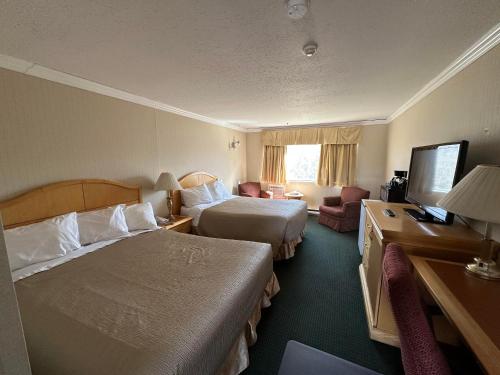 Postel nebo postele na pokoji v ubytování Stagecoach Inn