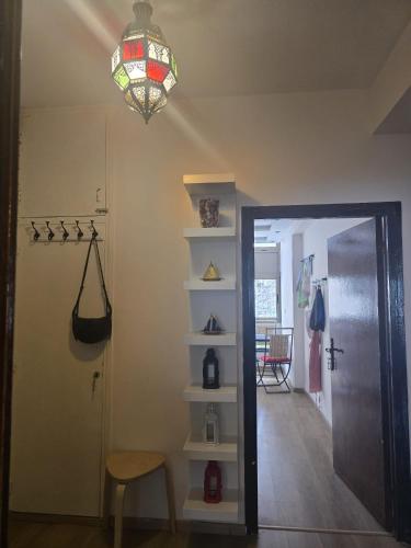 a room with a hallway with a door and a chandelier at Imperial Rabat - MAKE IT YOURS in Rabat