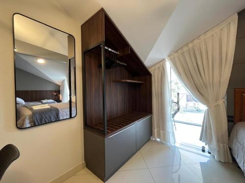 Ένα ή περισσότερα κρεβάτια σε δωμάτιο στο Loft Dona Clara 203 no Centro de Pomerode