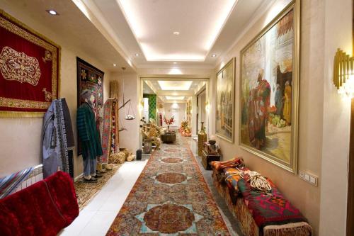 a hallway with a long rug on the floor at HOTEL SILK ROAD EMPIRE SAMARKAND in Samarkand