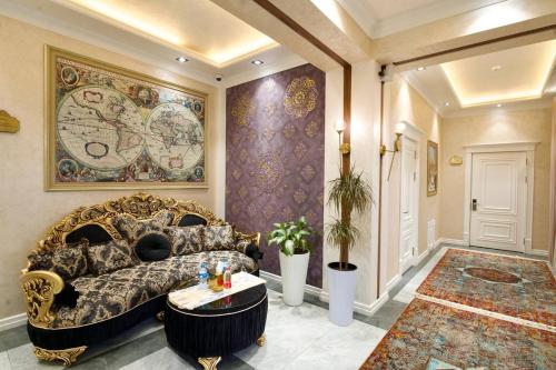 a living room with a couch and a table at HOTEL SILK ROAD EMPIRE SAMARKAND in Samarkand