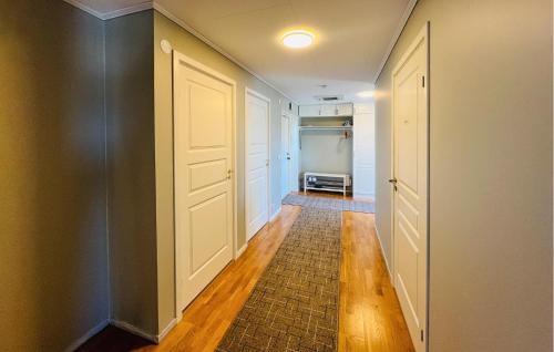 an empty hallway with a door and a room at 2 Bedroom Lovely Home In Uddevalla in Uddevalla