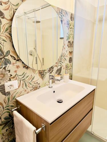 a bathroom with a sink and a mirror at Casa Caterina in Taormina