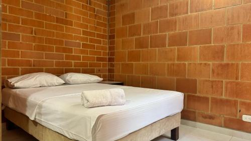 Ένα ή περισσότερα κρεβάτια σε δωμάτιο στο Habitacion Brisas Ricaurte