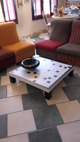 a living room with couches and a coffee table at L'Antica Cantina in Usini