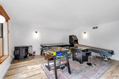 a living room with a ping pong table and a ping pong tablektop at Happy Days Retreat with Private Pool in Bass Lake Annex