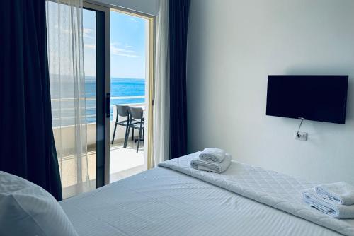 Postel nebo postele na pokoji v ubytování Hotel Mane