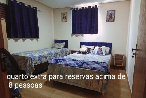 Postel nebo postele na pokoji v ubytování Casa a 5 minutos a pé da Basílica e da feira em Aparecida