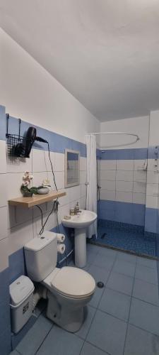 a bathroom with a toilet and a sink at Rocks View Apartment in Durrës