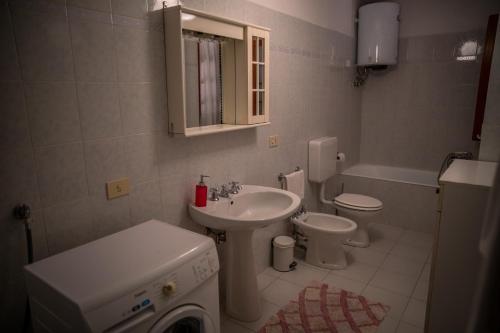 a bathroom with a sink and a toilet at L'ulivo in Levanto