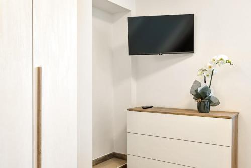 Μια τηλεόραση ή/και κέντρο ψυχαγωγίας στο Luxury Apartment - Colibrì