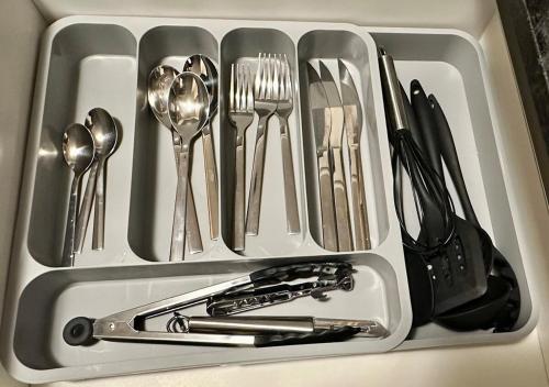 a drawer filled with utensils in a sink at Estudio cerca del Movistar Arena in Santiago
