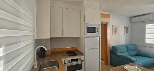Kuchyň nebo kuchyňský kout v ubytování Apartamento cerca del Mar, Layma