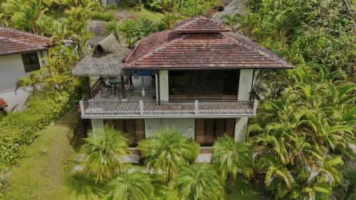 an aerial view of a house with palm trees at Villa Vista Mar in Dominical