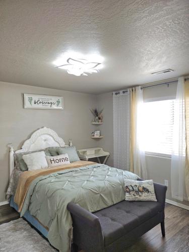 a bedroom with a bed and a window at providing spare luxury rooms for rent in Pasco