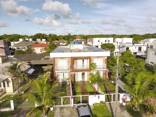 an aerial view of a house in a city at Moradas do Campeche CSABC in Florianópolis