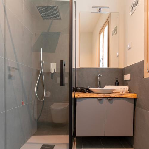 a bathroom with a sink and a shower at Antica Corte Lugo in Lugo