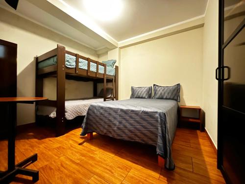 Postel nebo postele na pokoji v ubytování Hostal Bryan