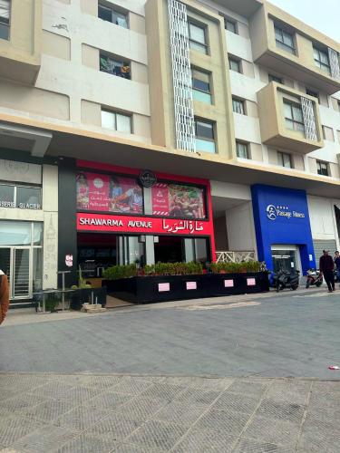 a building with a store in front of it at Studio moderne emplacement idéal in Anfa-Supérieur