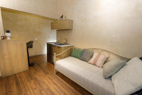 a living room with a couch and a sink at SA Studio 24 in Tirana