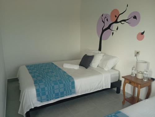 Katil atau katil-katil dalam bilik di Chilo's Bed and Breakfast