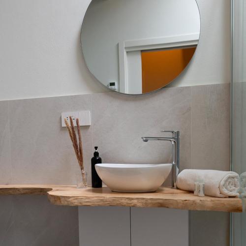a bathroom with a sink and a mirror at Antica Corte Lugo in Lugo