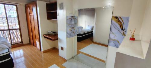 a living room with a room with a kitchen and a room with at Hotel Pinzon Plaza in Tunja