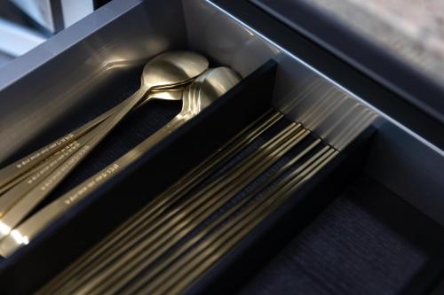 a pair of utensils sitting in a box at Odays Osiria Residence in Busan