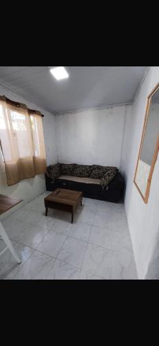 a small room with a couch and a coffee table at Apartment in an excellent location in Colonia del Sacramento