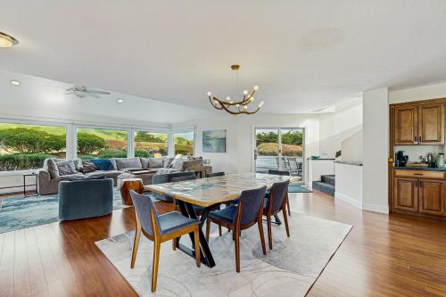 a kitchen and living room with a table and chairs at South Harbor Serenity in Bodega Bay