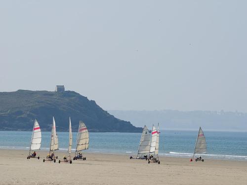 a group of sail boats on a beach at Apartment in Brittany near Pentrez Beach in Saint-Nic