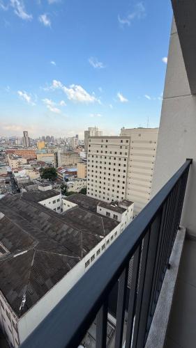 a view of a city from the balcony of a building at ZYZ Retratíl, Ar condicionado, Piscina e Estacionamento incluÍdo in Sao Paulo