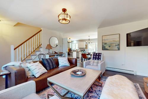 a living room with a couch and a table at Kindred Hollow in Ludlow