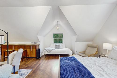 a bedroom with a bed and a desk and a window at Horsefeathers Farm Studio in Tolo